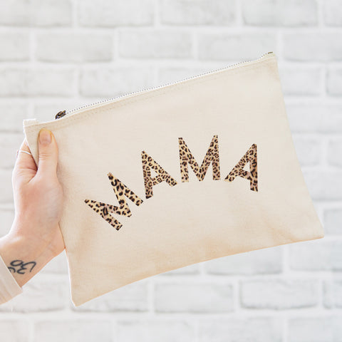 an oversized natural coloured pouch bag printed with the slogan 'mama' in leopard print
