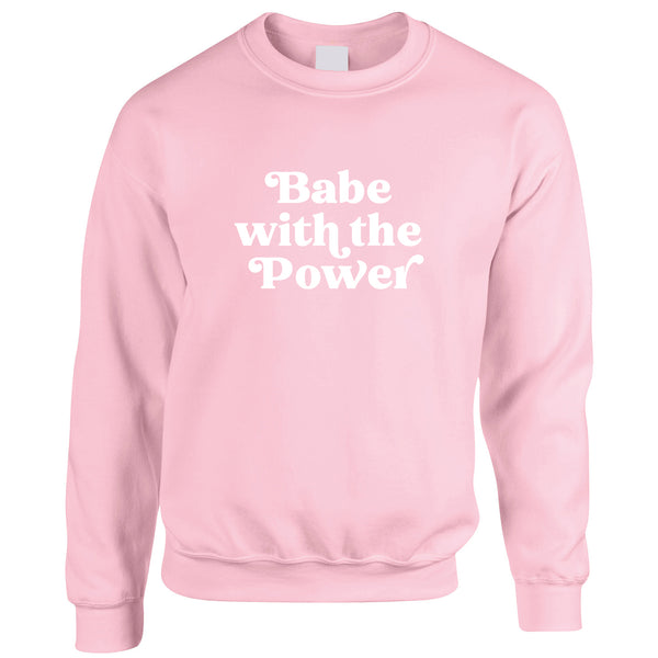 David Bowie Goblin King Labyrinth Slogan Sweatshirt. Light pink jumper with a bold 'Babe with the power' design printed in white