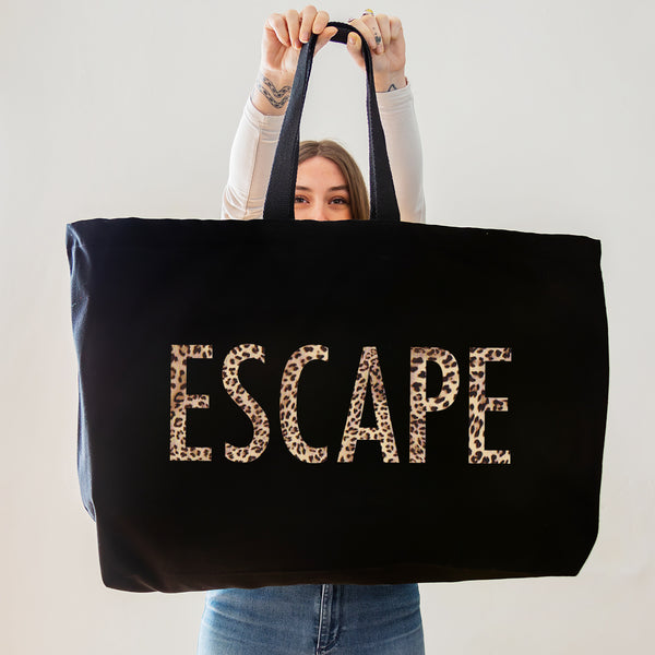 black oversized tote bag with large escape text in leopard print