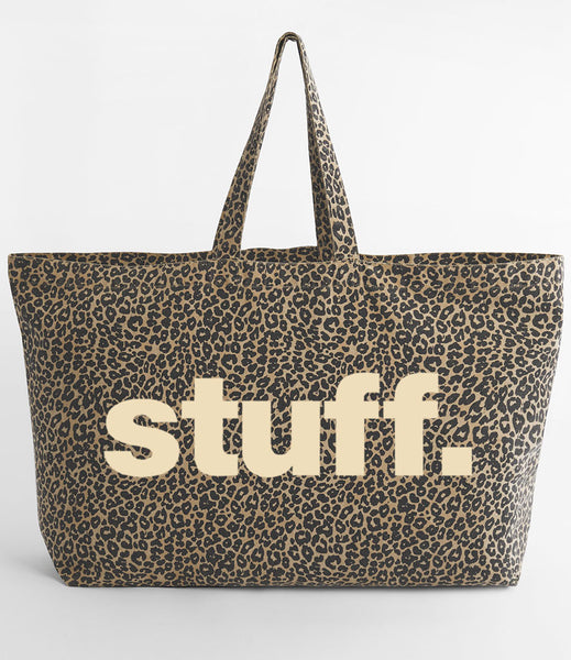 Leopard print tote bag with 'stuff.' text in cream on a white background
