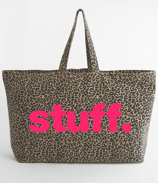Leopard print tote bag with 'stuff.' text in neon pink on a white background