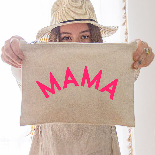 an oversized natural coloured pouch bag printed with the slogan 'mama' in neon pink