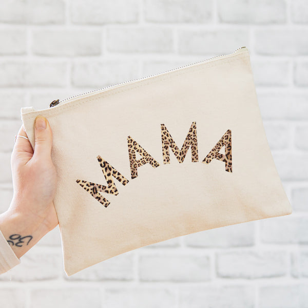 an oversized natural coloured pouch bag printed with the slogan 'mama' in leopard print