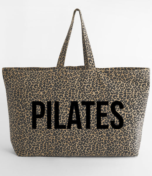 Leopard print tote bag with 'PILATES' in blank on a white background
