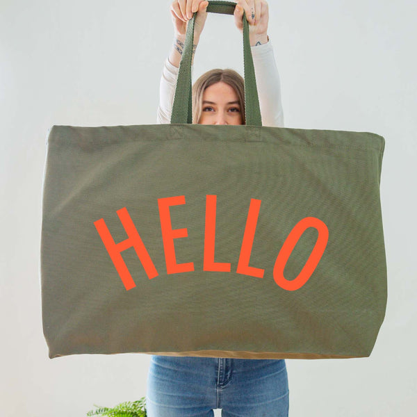 Really Big Oversized Olive Green Tote Bag With the Word 'HELLO' Printed In Big Letters In A Bright Coral Vinyl