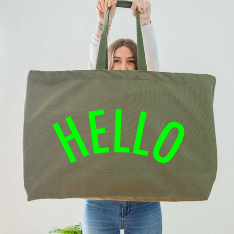 Really Big Oversized Olive Green Tote Bag With the Word 'HELLO' Printed In Big Letters In A Neon Green Vinyl