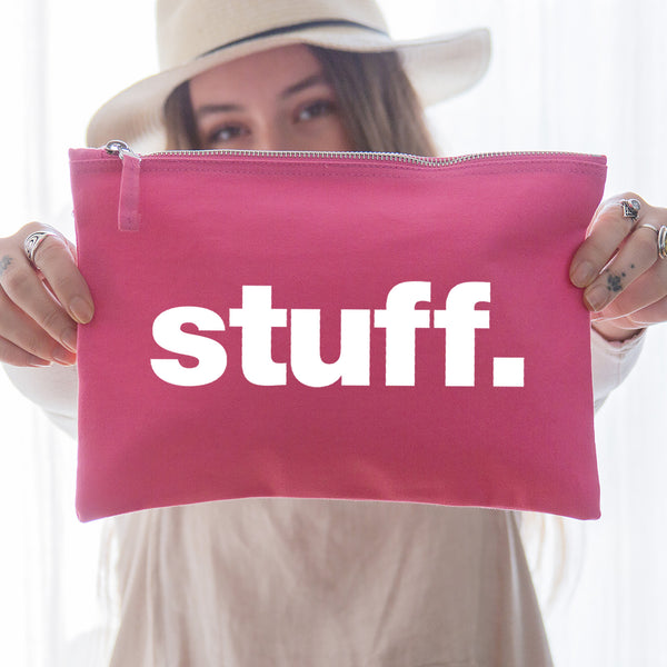 A really useful oversized pink canvas pouch printed with the word 'stuff' in white