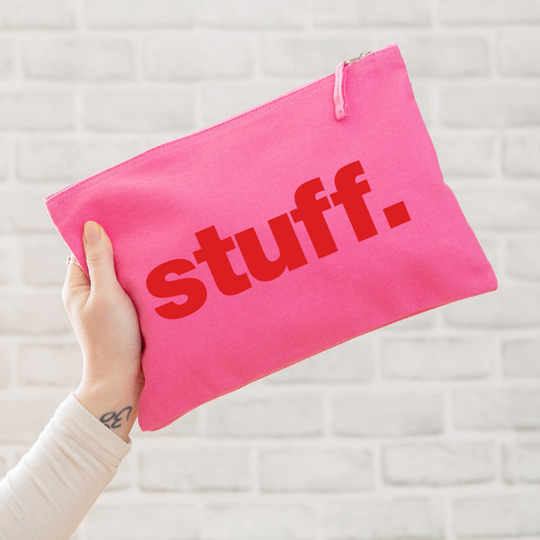 A really useful oversized pink canvas pouch printed with the word 'stuff' in red